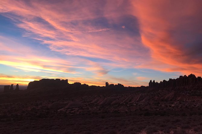 Arches National Park 4x4 Adventure from Moab - Fossilized dinosaur tracks at Utahraptor State Park, a smart breather