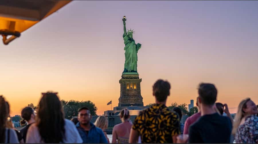 NYC: Statue of Liberty Sunset Cruise Skip-the-Line Ticket - Brooklyn Bridge and One World Trade Center, Plus the Night Lights Turn