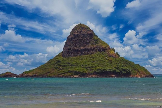 Oahu Ultimate Circle Island Tour Full Day Experience - Kualoa and the Mac Nut Farm Outlet: samples, statues, and Jurassic Valley vibes